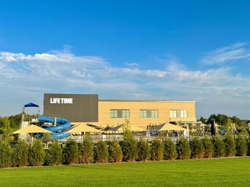 BRAND-NEW Life Time Fitness is located just down the street from our neighborhood and looks and feels more like a resort than a gym! It features indoor and outdoor pools (with water slides), swim lessons, spa, cafe and so much more!