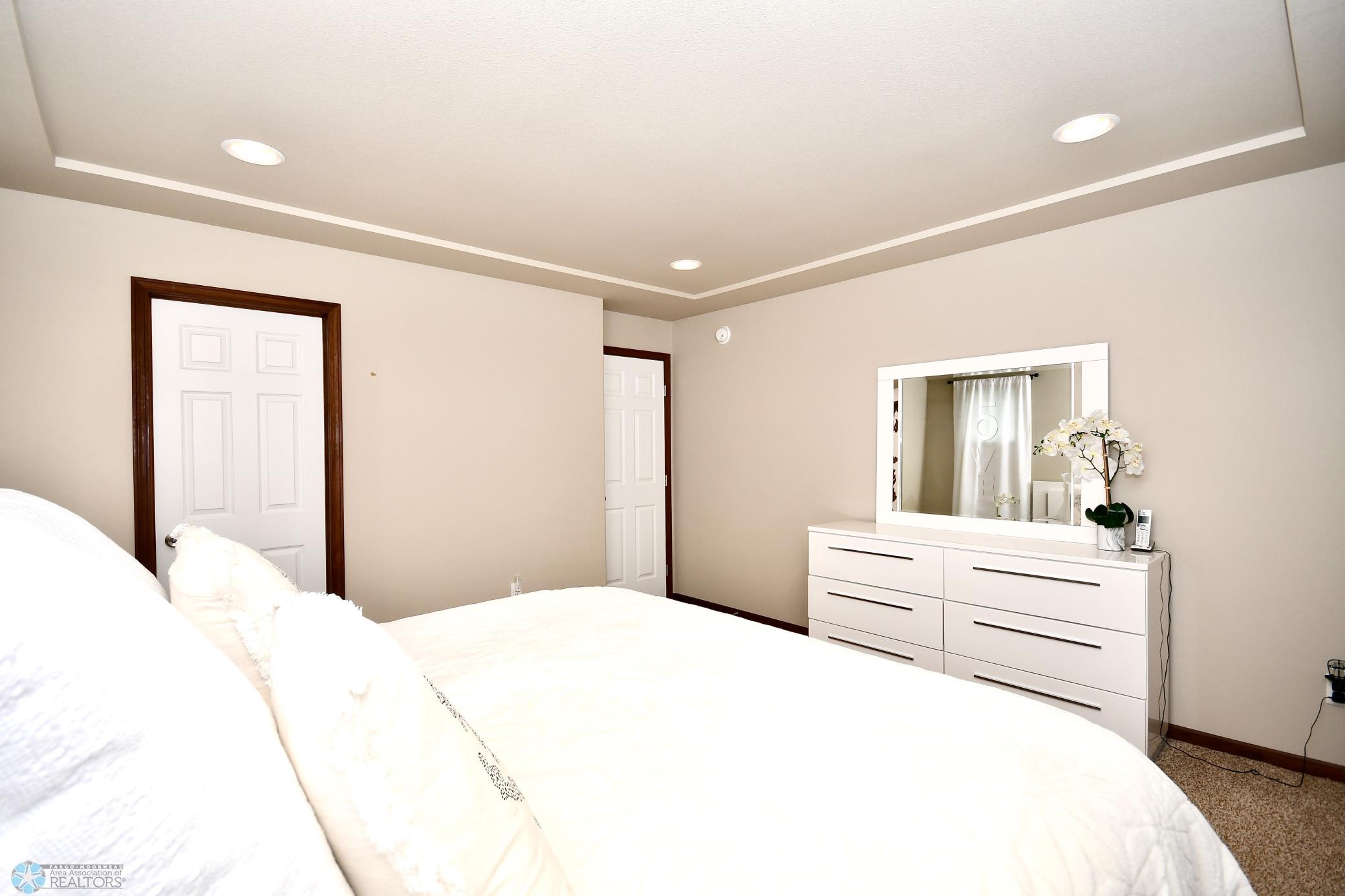 Master Bedroom with Recessed Lighing and Access to Master Bath