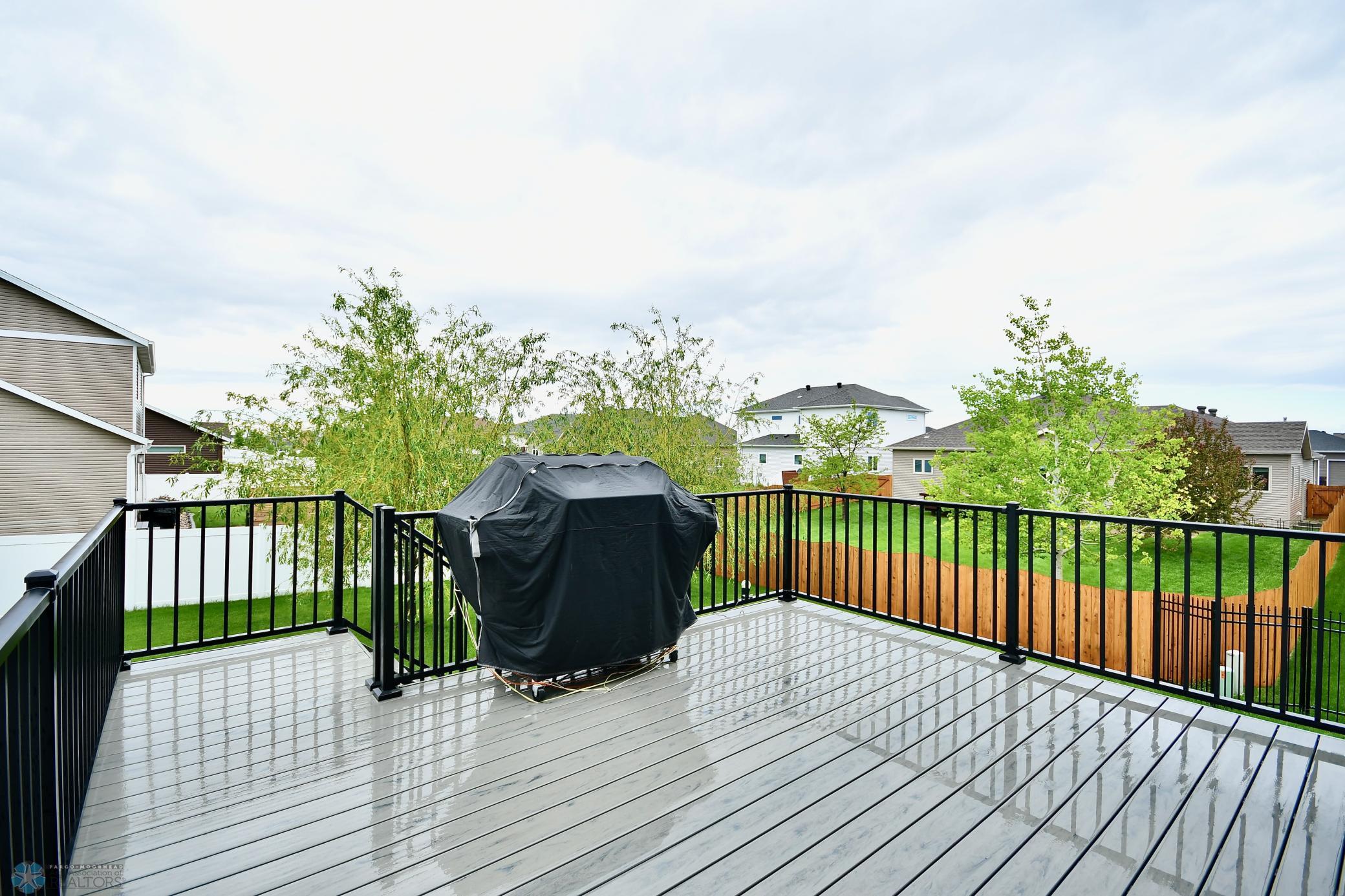 Large Maintenance-Free Deck with Wrought-Iron Fencing