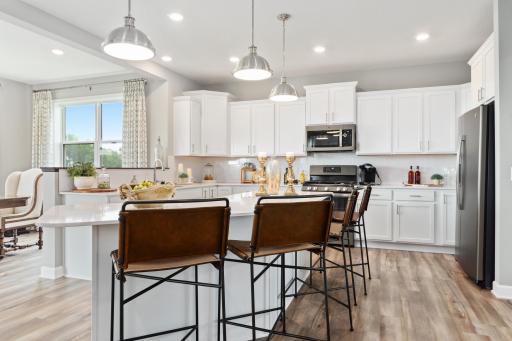 (Photo of a decorated model, actual homes finishes will vary) Enjoy a beautiful luxury kitchen which includes all of the kitchen appliances which are a modern slate finish.