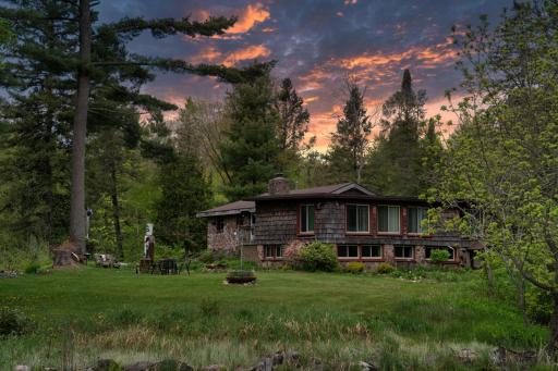 Situated on a sprawling lot spanning 215 feet of lakefront, this property offers unparalleled access to nature's beauty. Whether you're seeking a peaceful retreat, a place to entertain, or a haven for outdoor enthusiasts, this property has it!