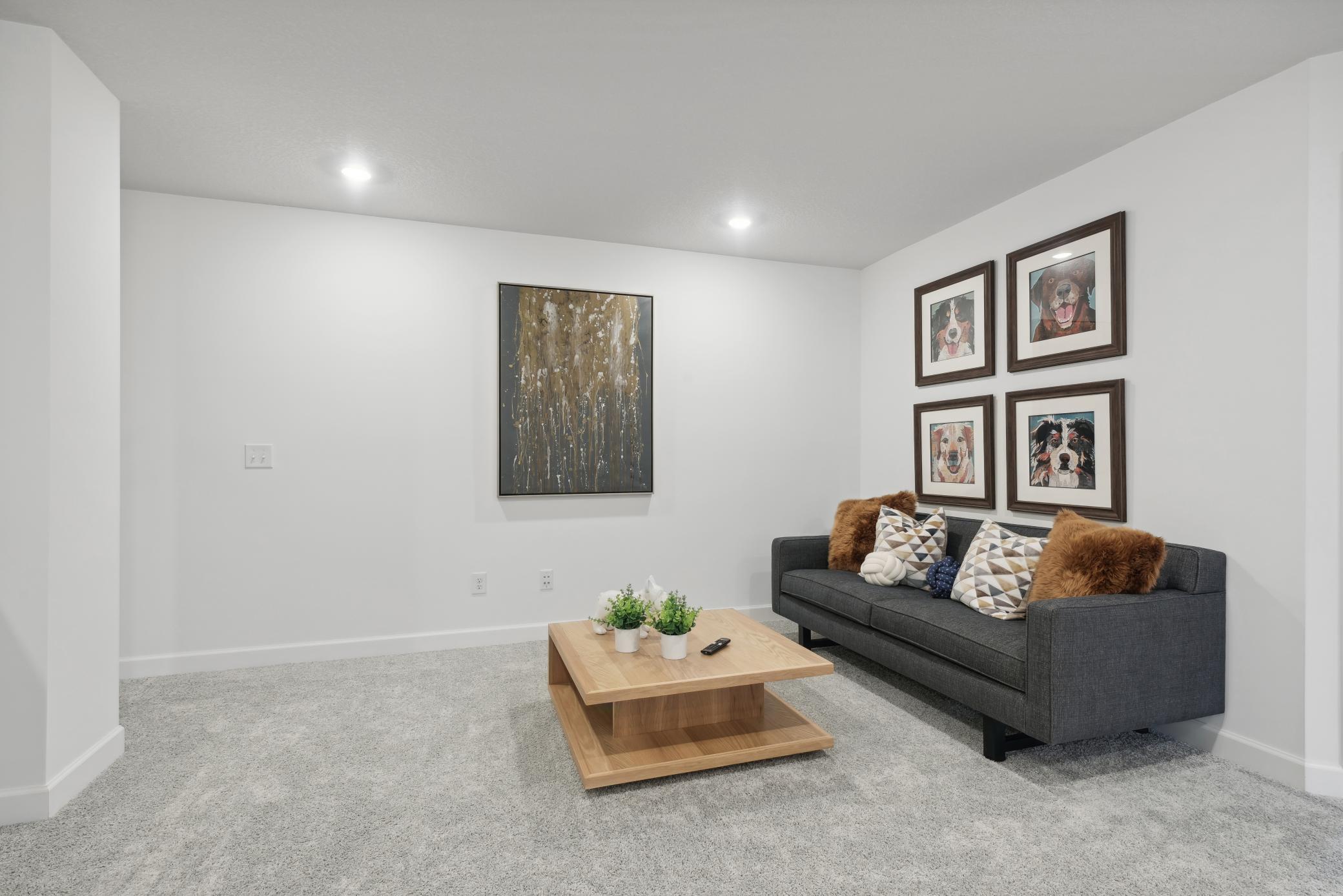 (*Photo of decorated model, actual homes colors and finishes will vary) Located on the upper level, this perfectly sized living space has enough room for a desk, television, and seating for the entire family.