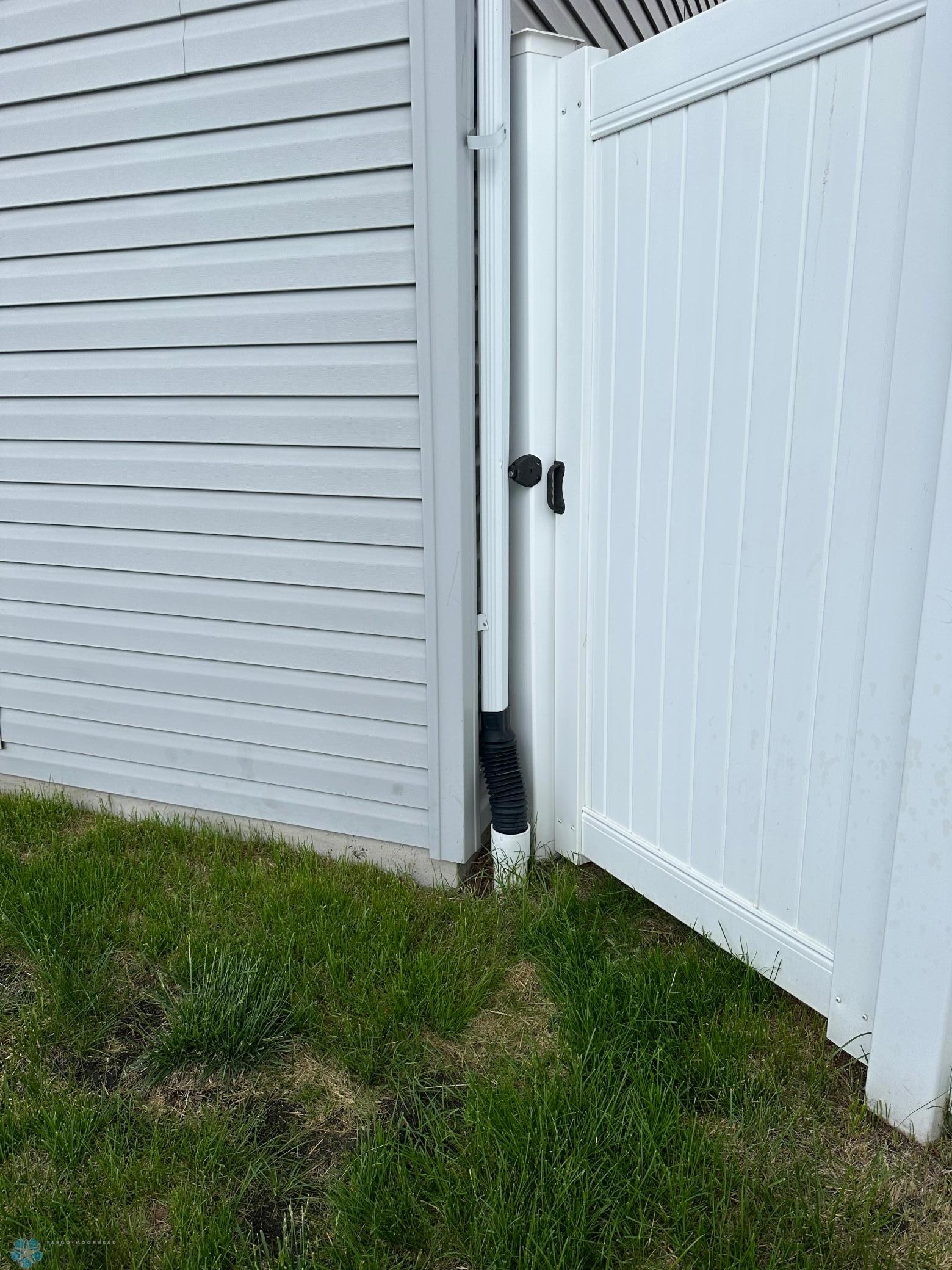 Downspout drains underground away from foundation