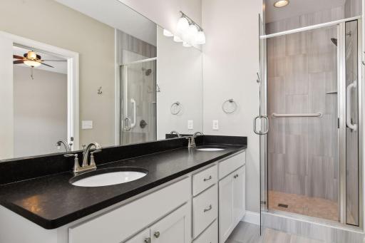 Primary bath with dual sinks and walk-in shower