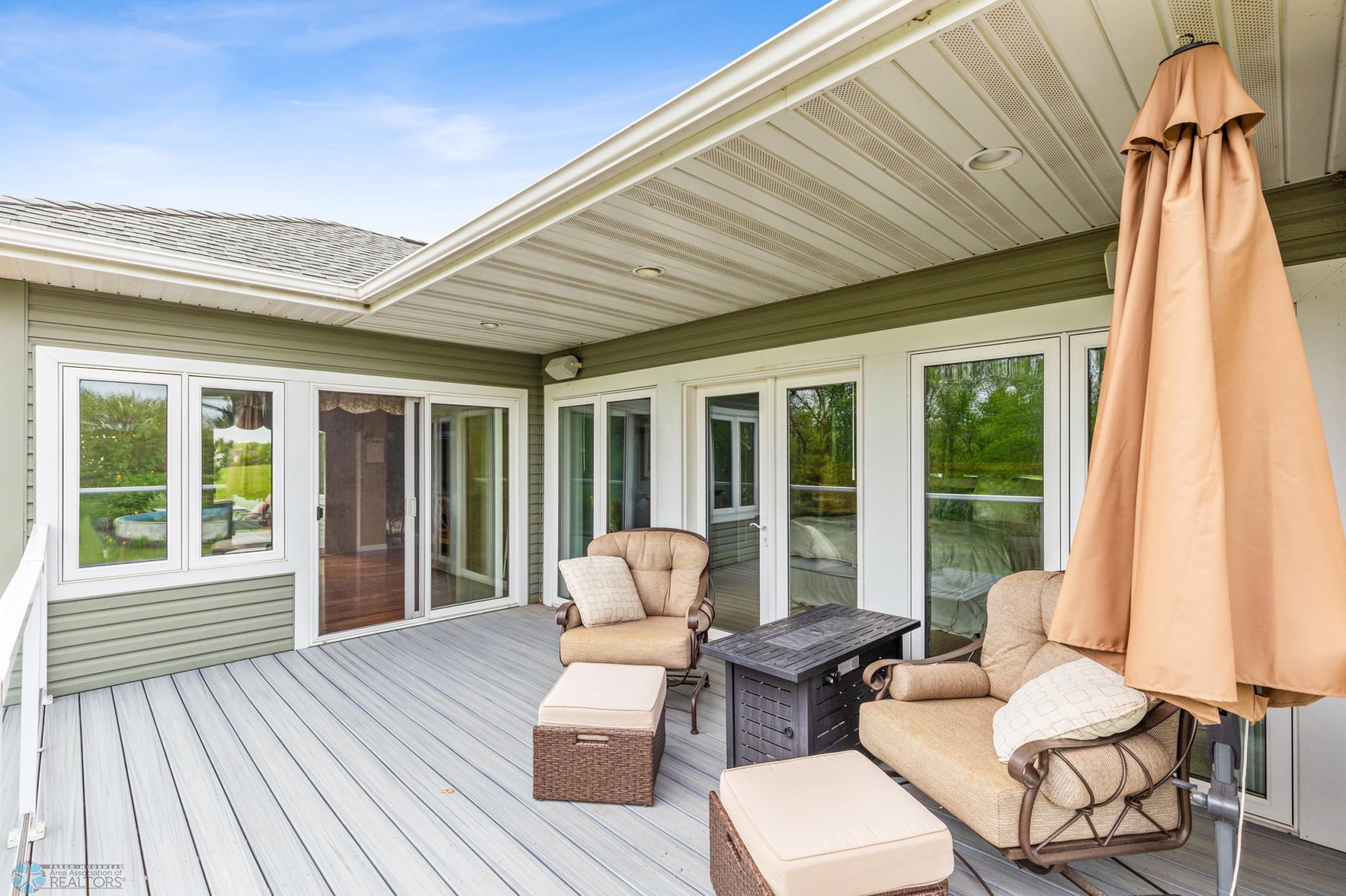 Deck off sunroom and primary bedroom