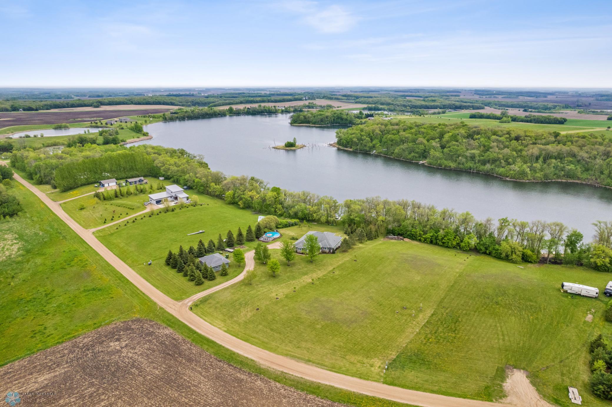 Aerial View - looking east/southeast. Vacant lot to the west (immediate right) is also available for sale, separately.