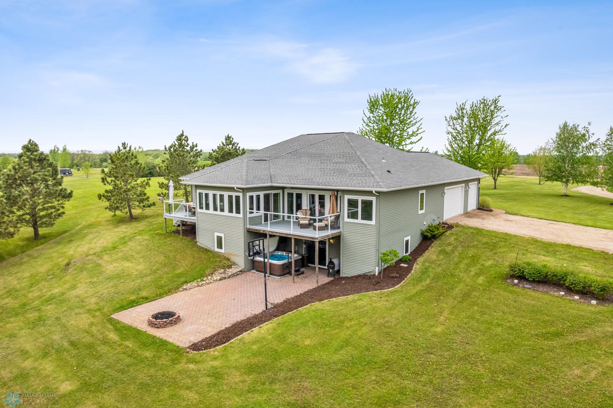 Back yard patio, fire pit, hot tub and 2 decks