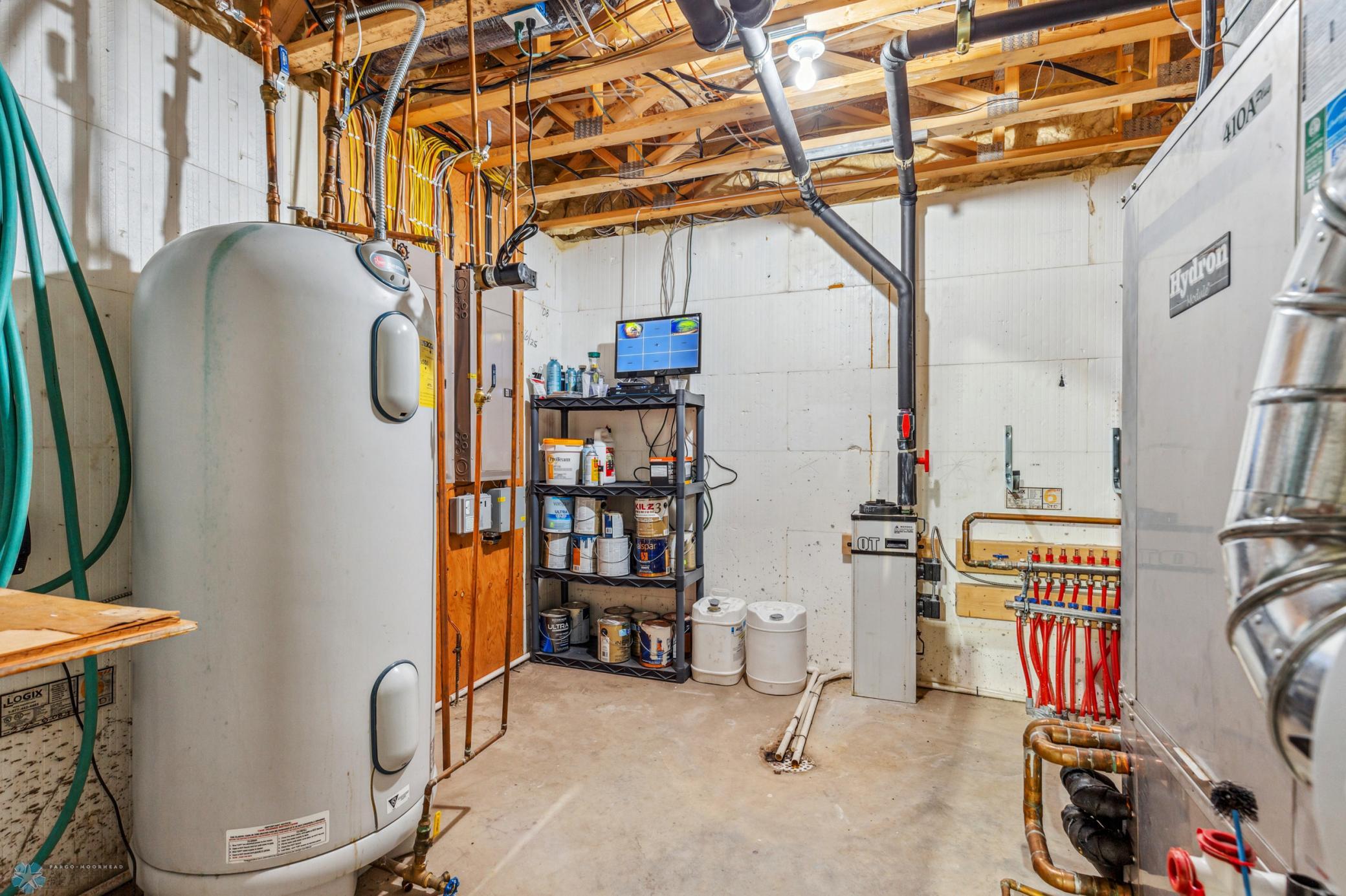 Utility Room - geothermal unit, XL water heater, screen for security system.