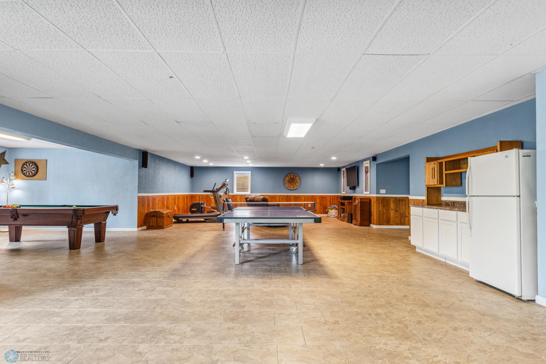 This space is enormous! Perfect for entertaining guests, or section it off and add another bedroom downstairs. Pool table included (has 1" thick slate top - almost new!)
