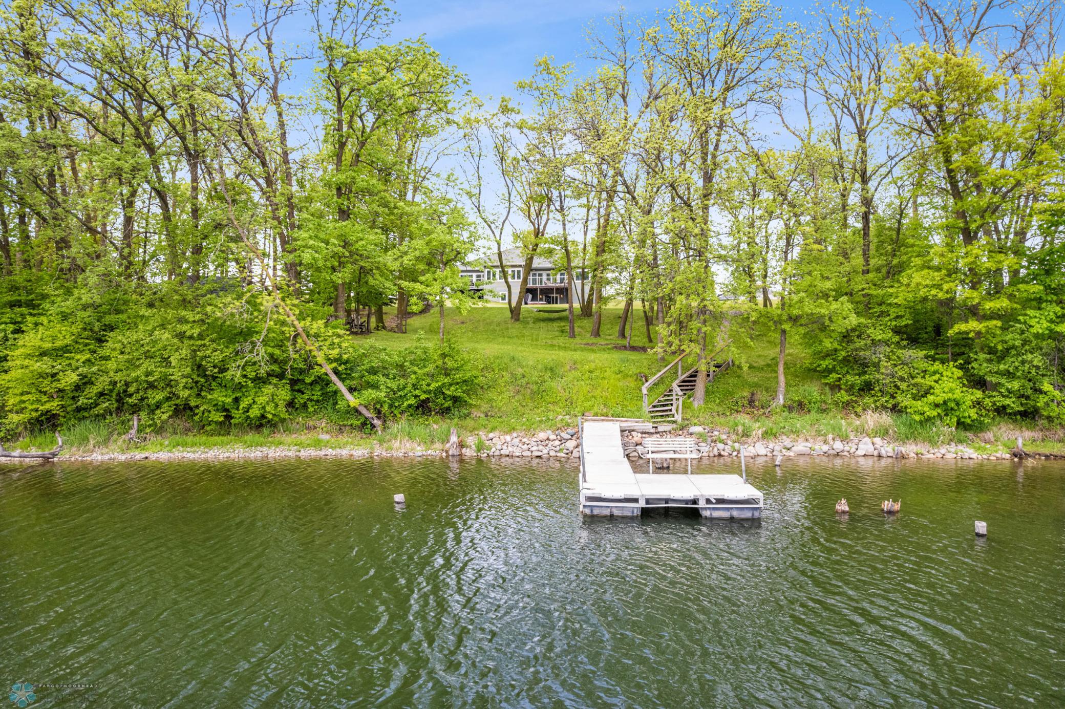 Welcome to Pete Lake! 4 Bedrooms, 4 Baths, Large gathering spaces, heated pool, shop... the list goes on!Gradually sloped shoreline is accessible, peaceful and serene.