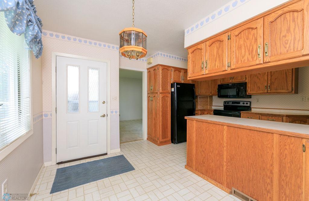 View of kitchen & entry, from breakfast nook