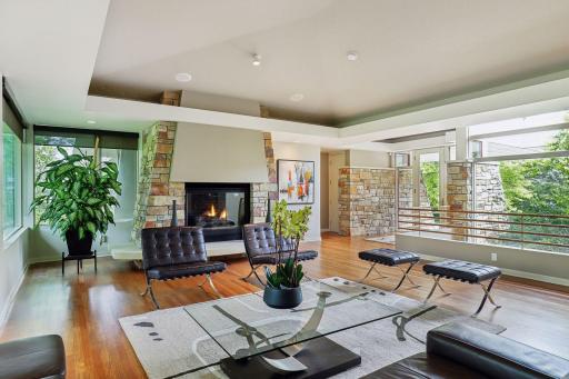 Views toward front and rear of home, featuring an incredibly designed fireplace and staircase