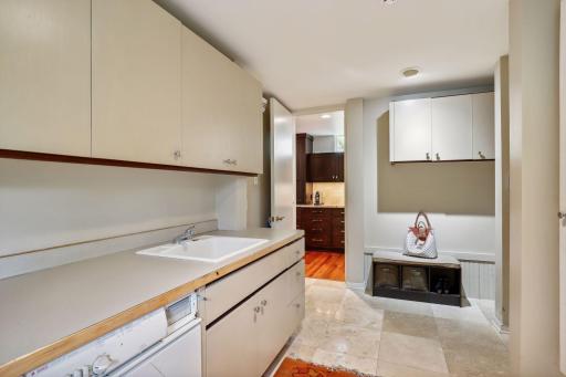 Mudroom with washer/dryer leading into kitchen