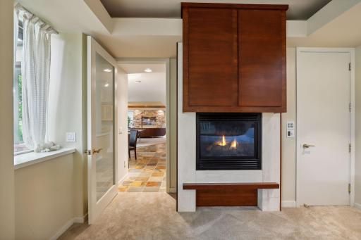 Lower level guest bedroom with gas fireplace