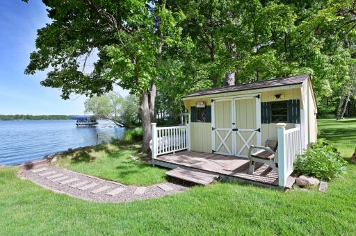 Lake side storage shed with cute deck space