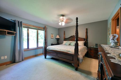 Main level primary bedroom with stunning lake views