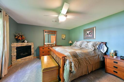 Lower level bedroom with electric fireplace