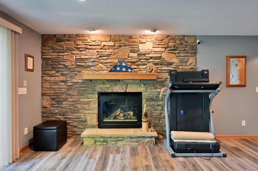 Floor to ceiling stone surrounding the gas fireplace