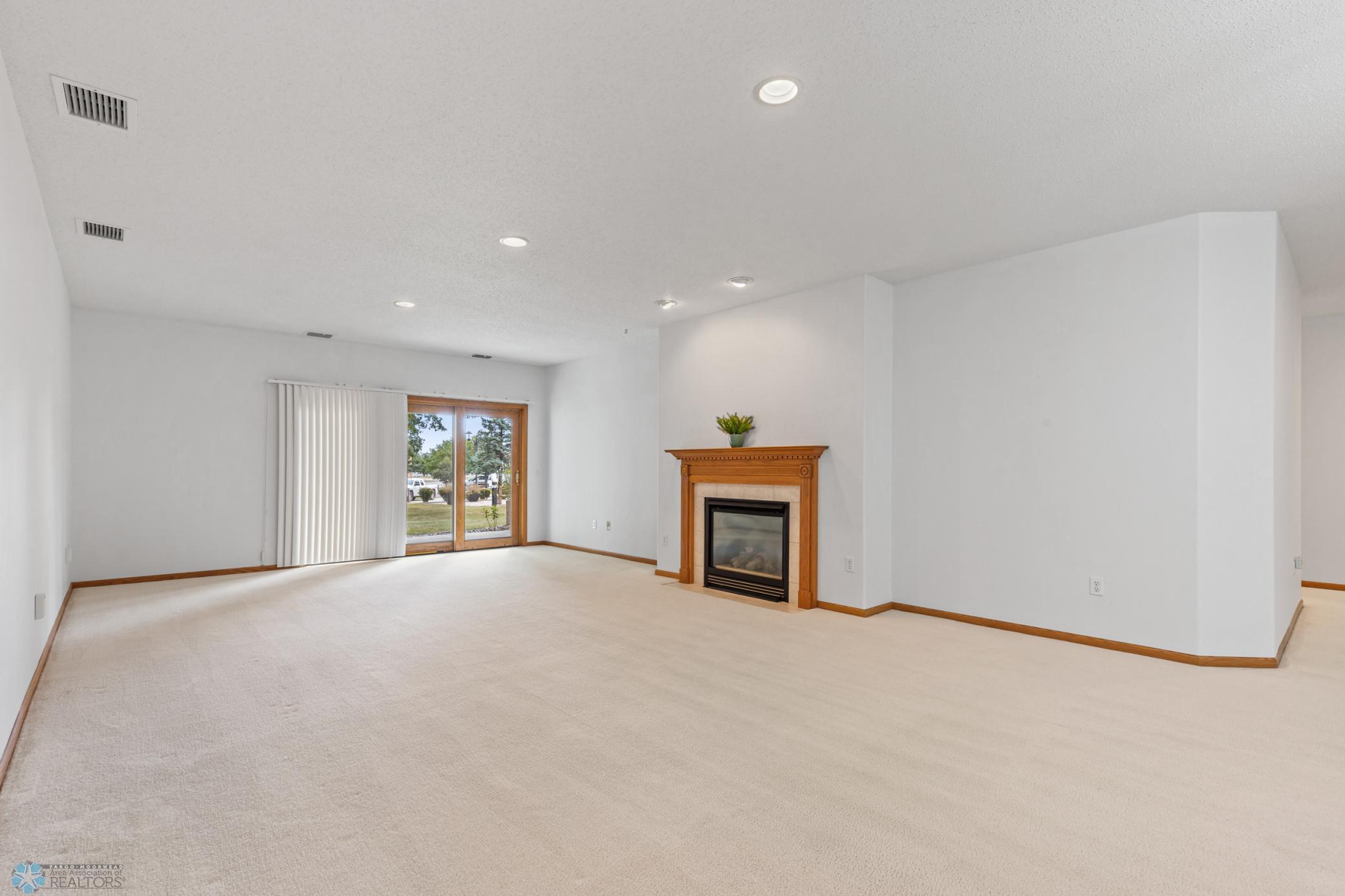 Living area, gas fp, door to patio