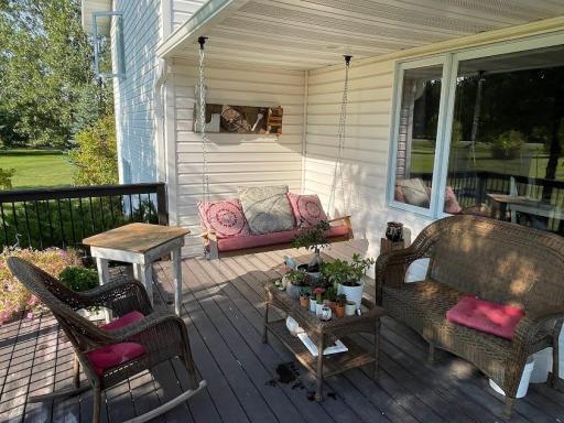 Enter the home from the front covered porch with 2 swings and space for outdoor furniture.