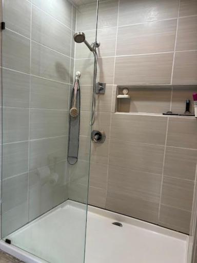 Master suite custom tiled walk-in shower.