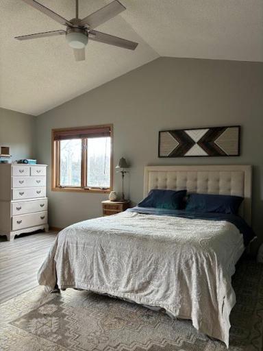 Upper level private Master suite with vaulted ceiling, luxury vinyl flooring, large closet and lots of natural light.