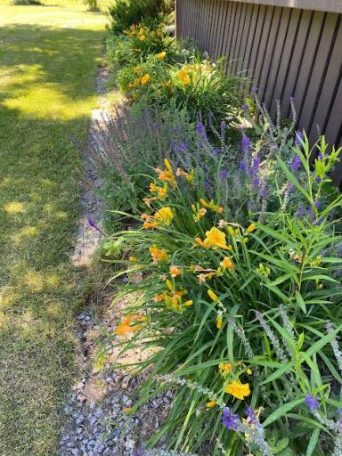 Enjoy the perennial gardens around the front deck.