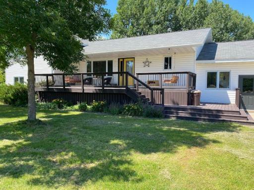 Enter your home on the tiered large front deck.
