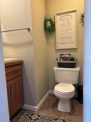 Main floor bathroom with new luxury vinyl, just off the back entry.