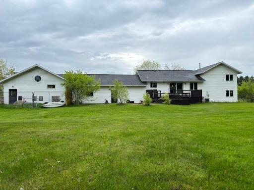 Huge backyard with fire pit and patio plus a dog kennel attached to the garage.