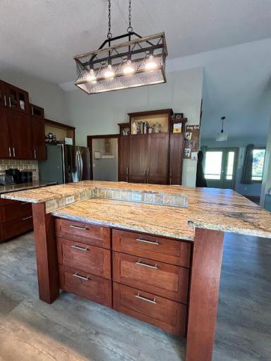 A view from kitchen to front door that opens to the large front deck.