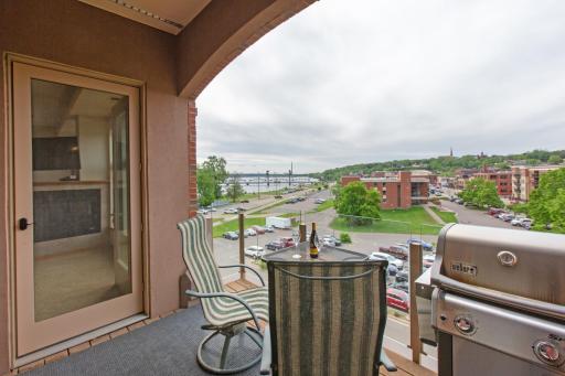 Covered deck is a comfortable place to watch all of downtown Stillwater and traffic on the river.