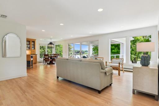 Beautiful hardwood floors flow throughout the main level gathering areas
