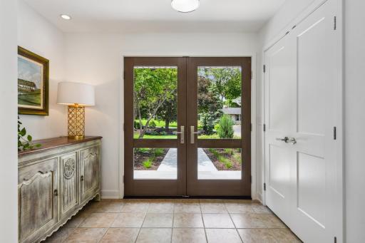 Double doors enter into the spacious foyer