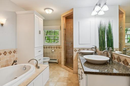 Main level full bath with separate jetted tub and shower
