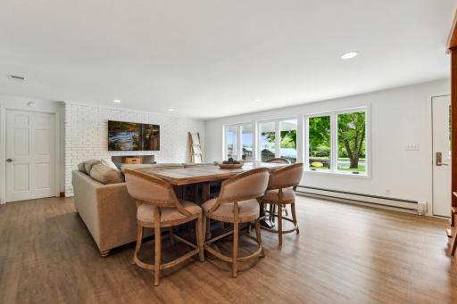 The lower level features a large family room with bar, built-in storage and fantastic sectional and game table.