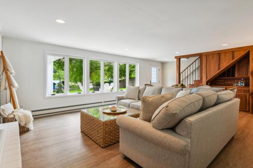 The family room walks out to the sun patio and lakeside yard.