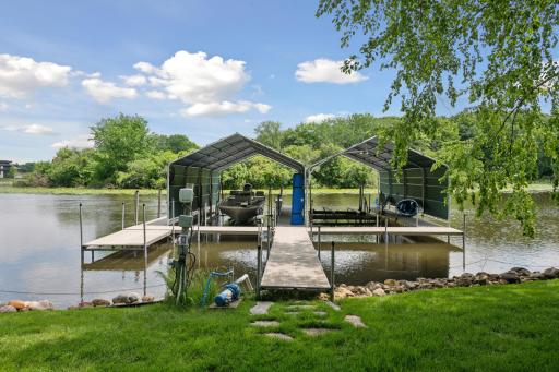 The cove offers the convenience to keep your dock in year-round. Enjoy this large two boat house dock with electricity.