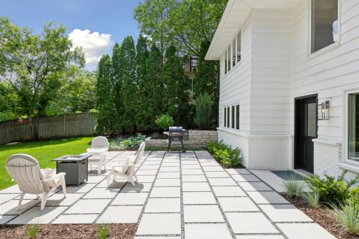 The sun patio was professionally designed and is bordered by beautiful perennial landscaping.