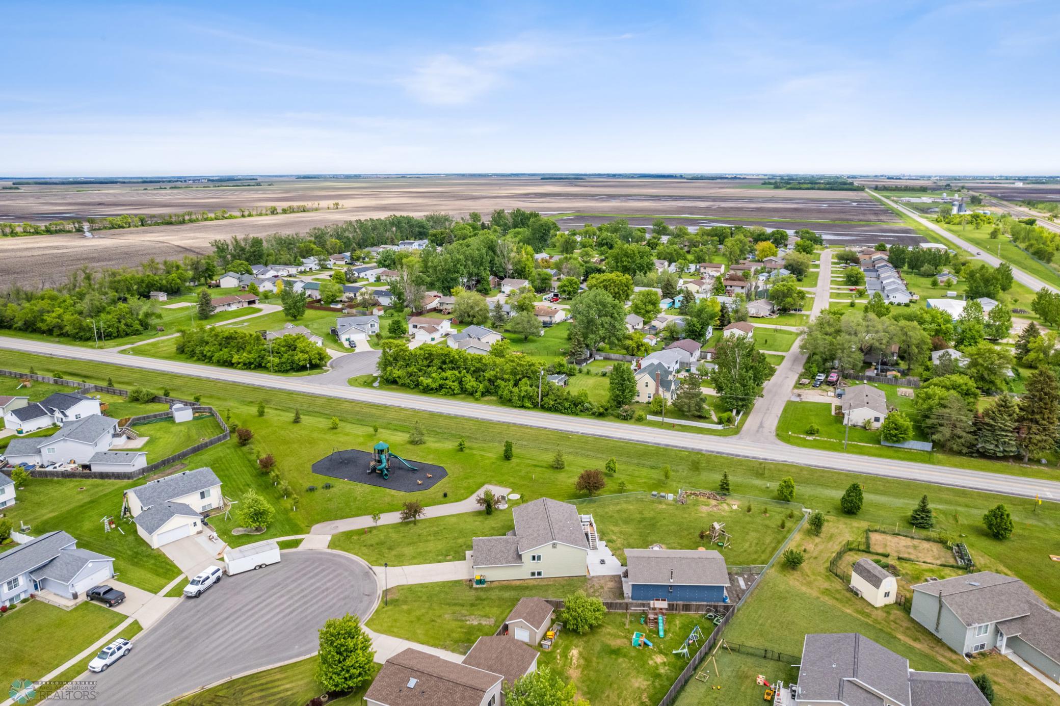 Aerial View - house, shop, city playground on the cul de sac