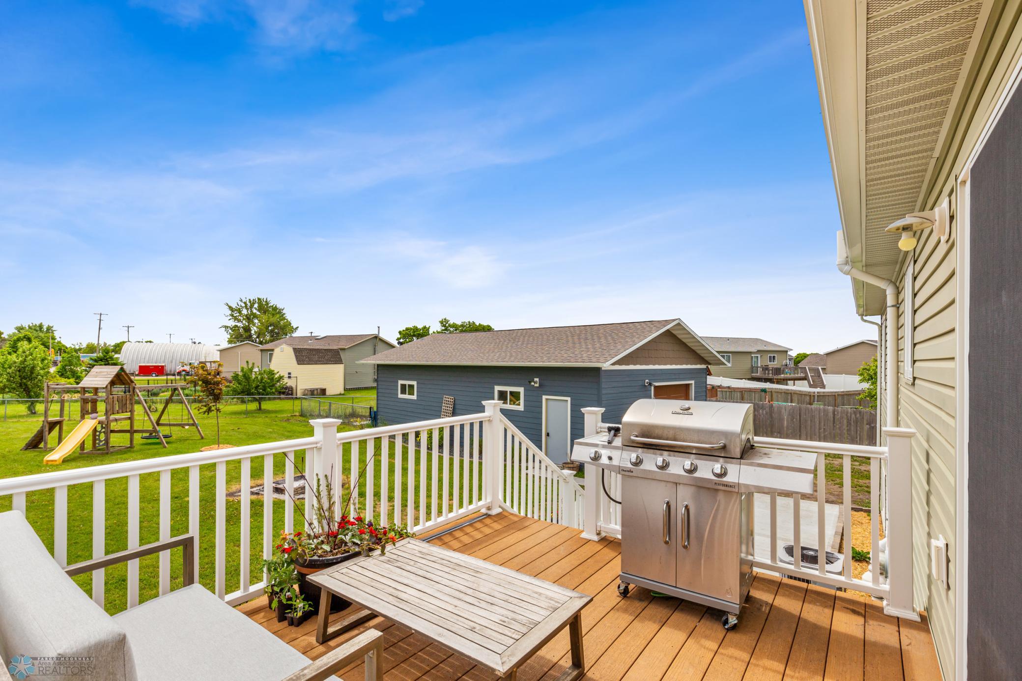 Deck overlooking the massive fenced yard