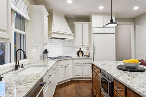 Beautiful custom hood above 5 burner gas cooktop