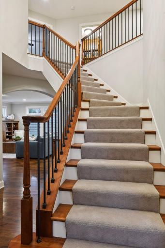 Brand new carpet on the beautiful wrought iron stairway leading to the upper level