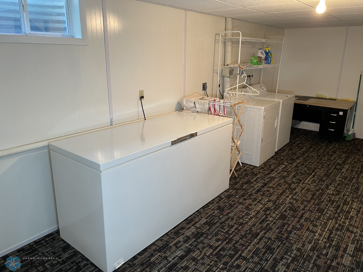 Laundry room. Washer, dryer, chest freezer and desk included