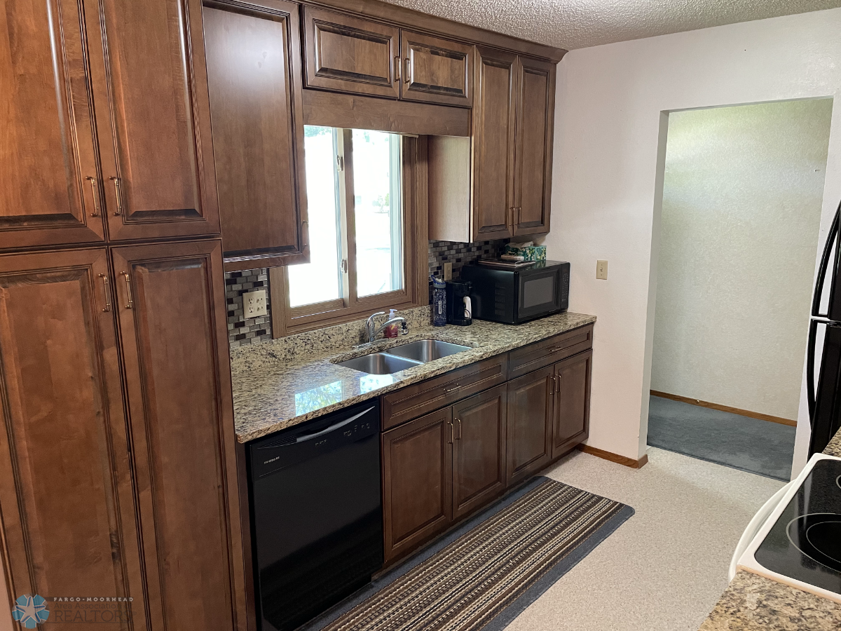 Remodeled kitchen with granite counters