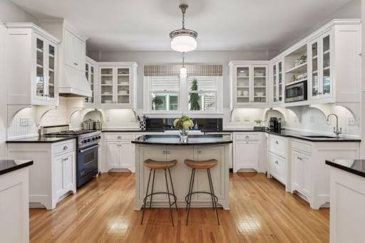 Beautiful white kitchen cabinets with granite countertops and gourmet appliance package.