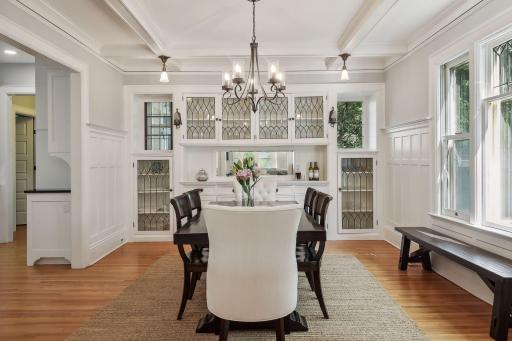 Gorgeous and timeless details in this dining room with leaded glass cabinets and built-ins. Tons of extra storage!