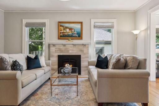 Main level living room space with gas fireplace.