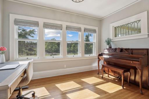 Perfect front spot for a home office and piano room, overlooking the adorable park across the street.