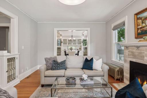 Living room views into the dining room and gorgeous built-ins.